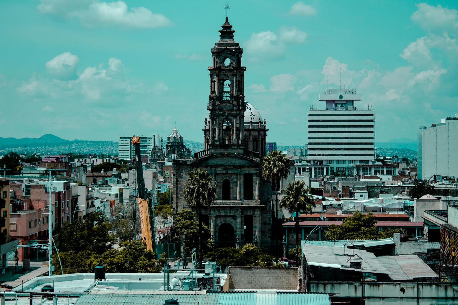 A vibrant view of historic architecture amidst the urban landscape of Guadalajara, Mexico.