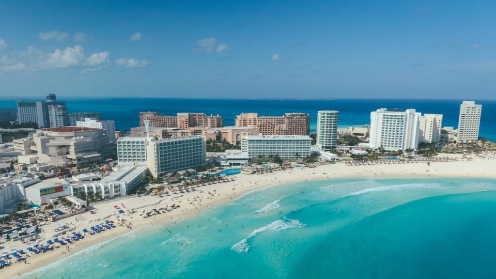 A stunning aerial view of Cancun's beachfront hotels and turquoise waters.